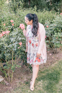 girl stopping to smell the roses