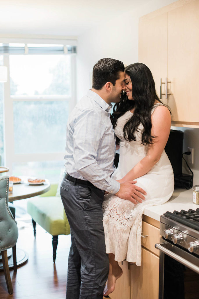 Stay at home date night ideas. Dancing in the kitchen while making dinner together as a couple. Perfect for a budget friendly and fun date night at home