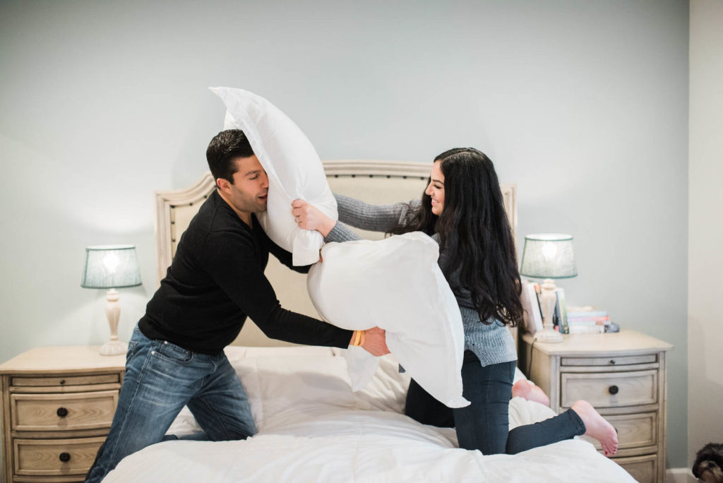At home date night ideas. Having a pillow fight for a fun way to strengthen your bond