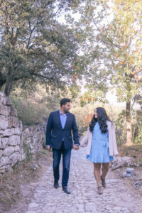 Couple walking through Oppede, Provence