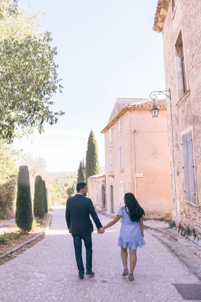 Couple walking in Oppede, Provence