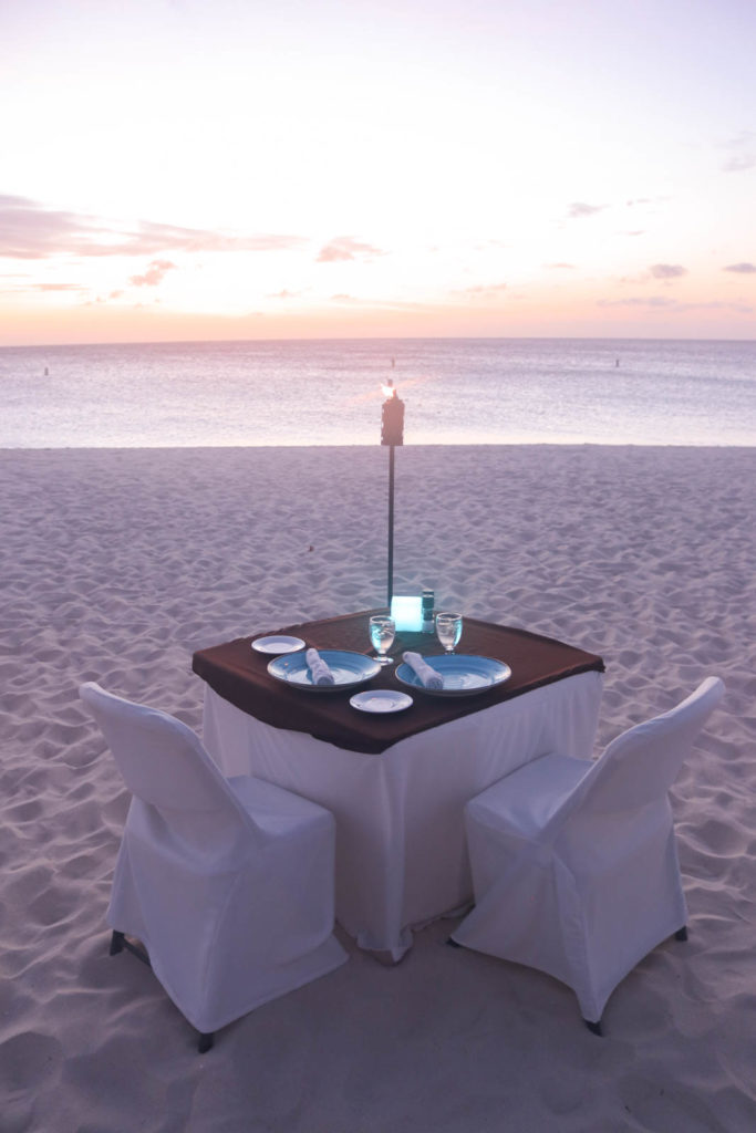 Romantic beach dinner for Aruba honeymoon