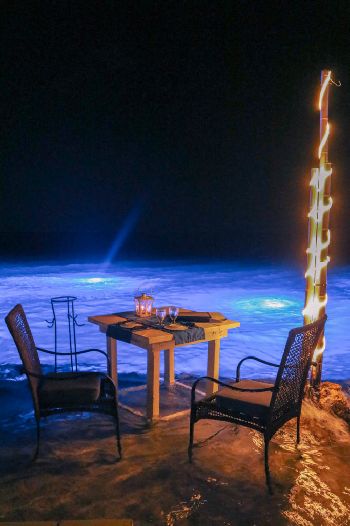 Dinner with feet in the water, romantic Aruba honeymoon