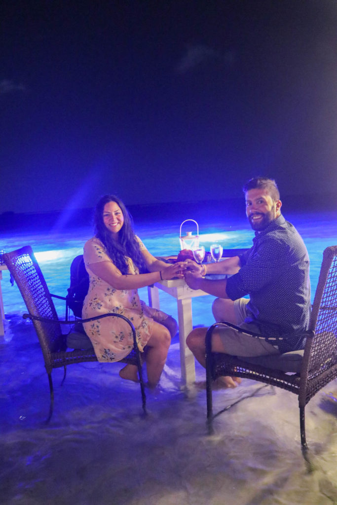 Dinner with feet in the water, romantic Aruba honeymoon