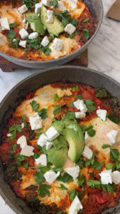 photo of two pans containing vegetable shakshuka